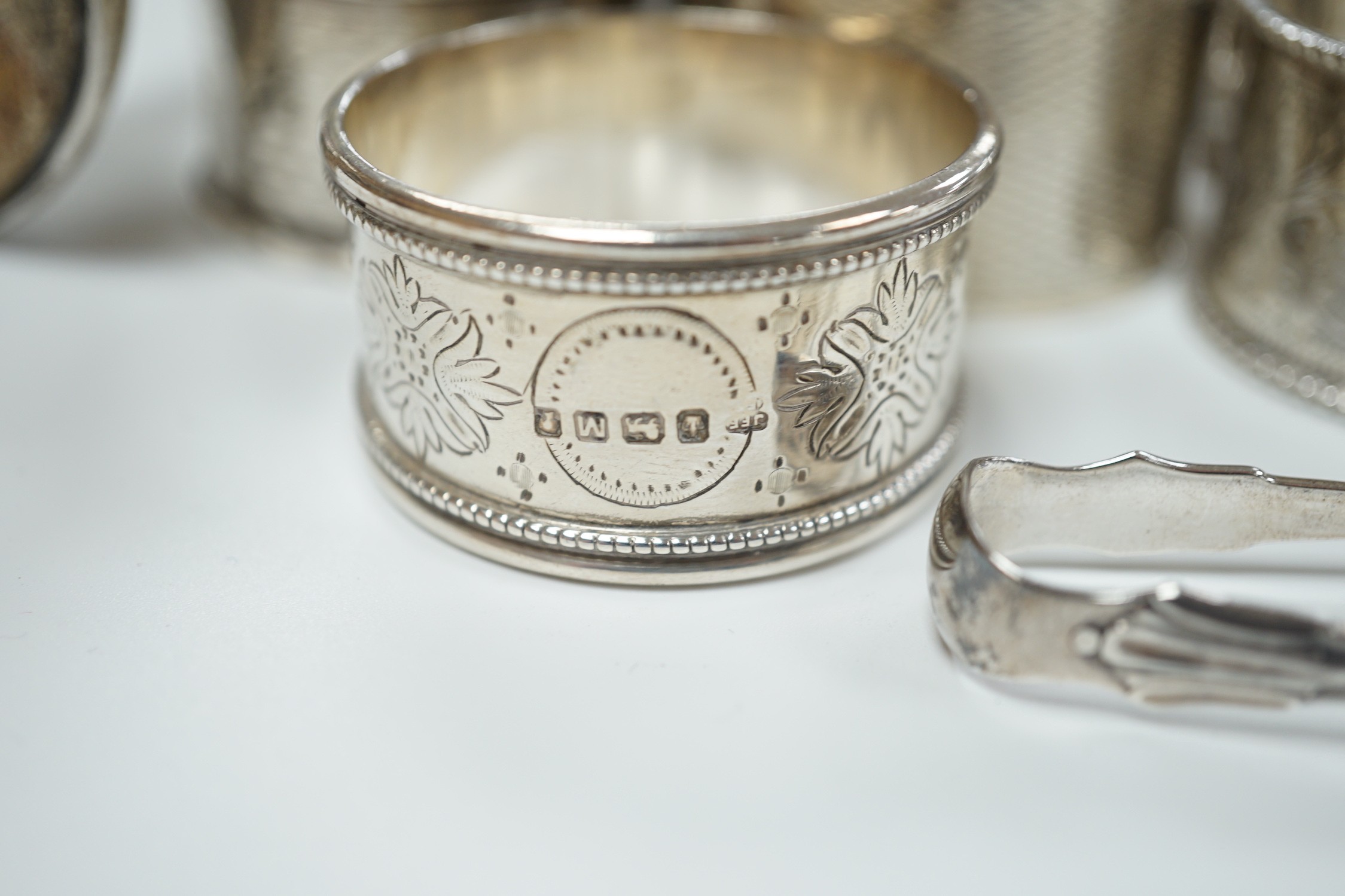 A small collection of assorted small silver including five napkin rings, a posy vase, two pepperettes, two small salts including Irish(marks very rubbed) and twenty eight small spoons.